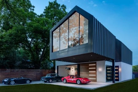 Modern house with cars in garage