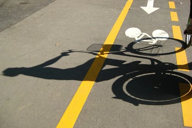 Cyclist shadow on bike lane